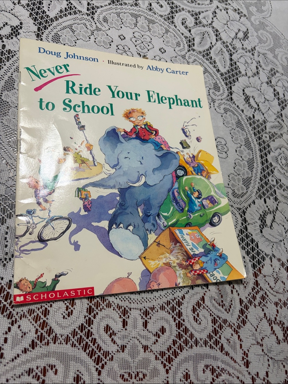 Scholastic Never Ride Your Elephant to School - Kids Picture Book (White/Blue)